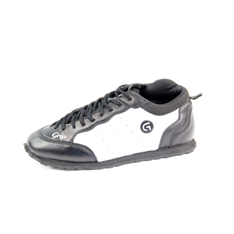 Chaussure noire et blanche Grip vue latérale.