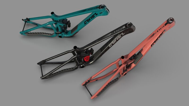 Trois cadres de vélos de montagne colorés.